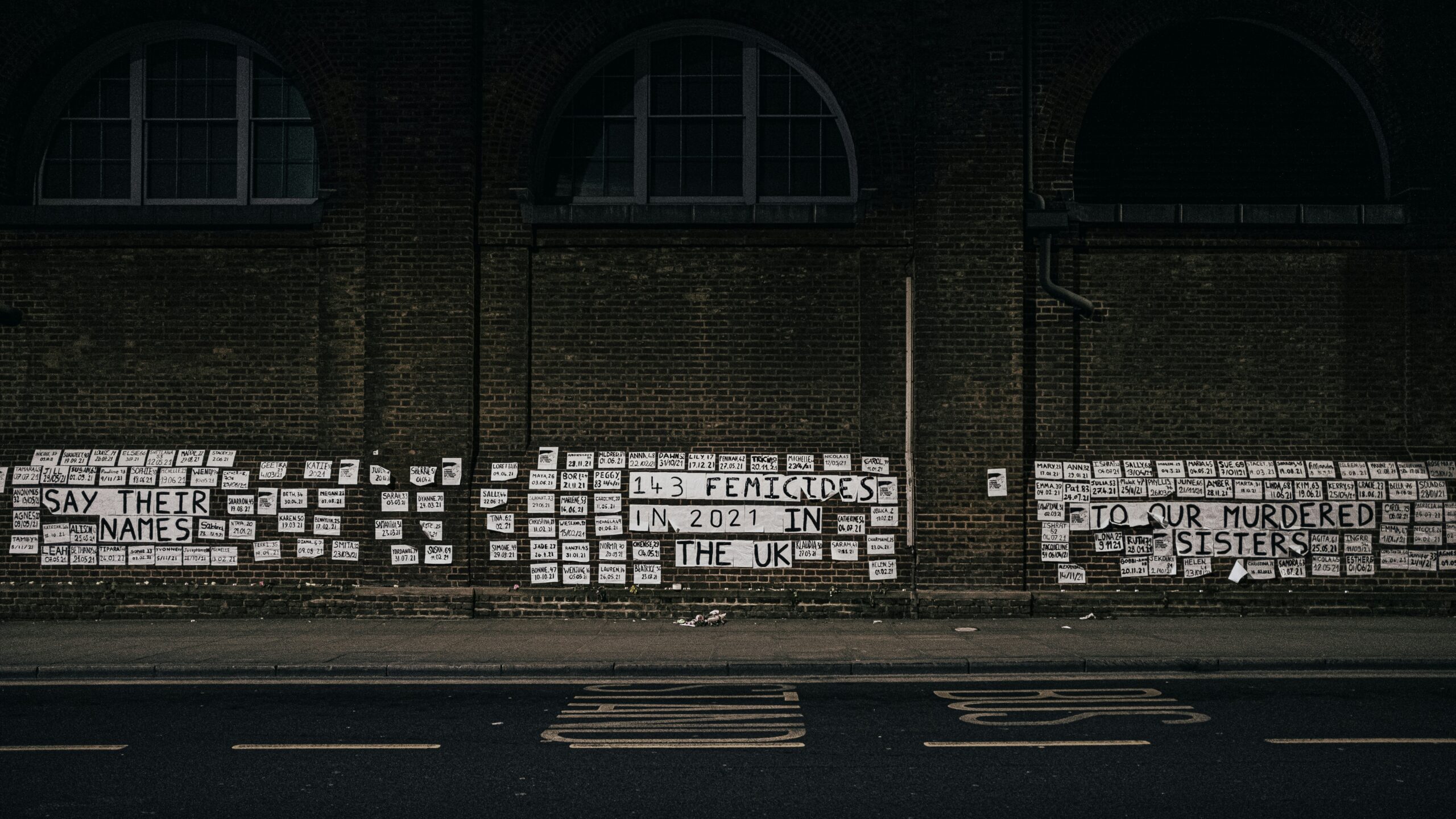 a building with a lot of newspaper on the side of it